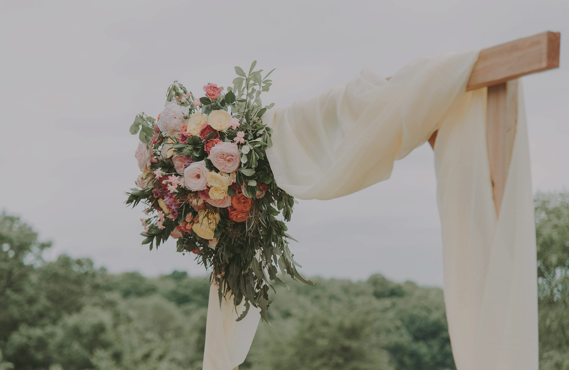 wooden arc with flowers